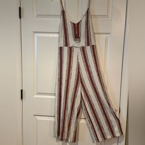 jumper copper-tan, black cream pin-stripe style key-hole opening mid section